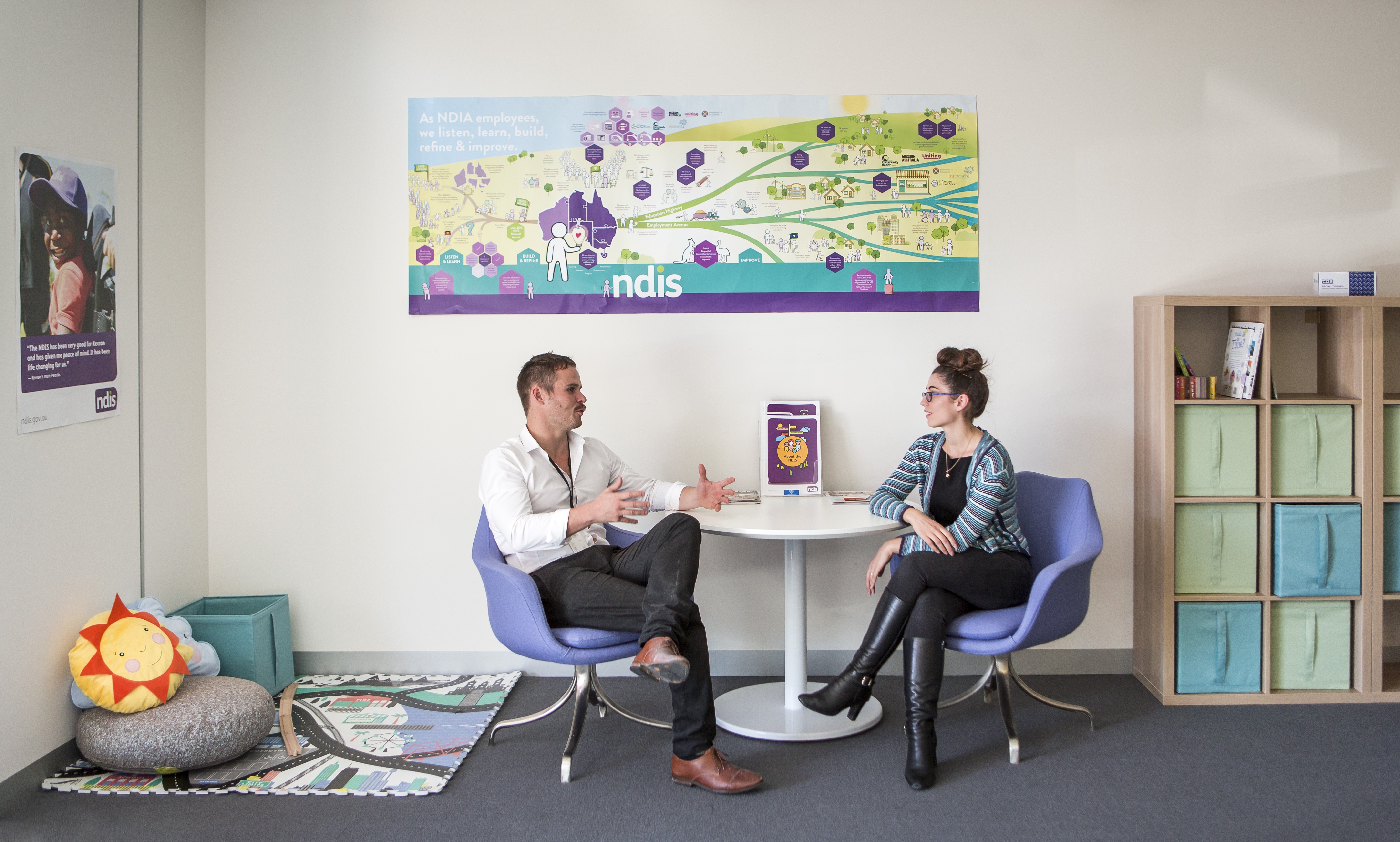 Two Brotherhood team members in discussion within a Brotherhood NDIS office